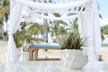 Outdoor massage cabana on tropical beach, perfect for luxury retreats