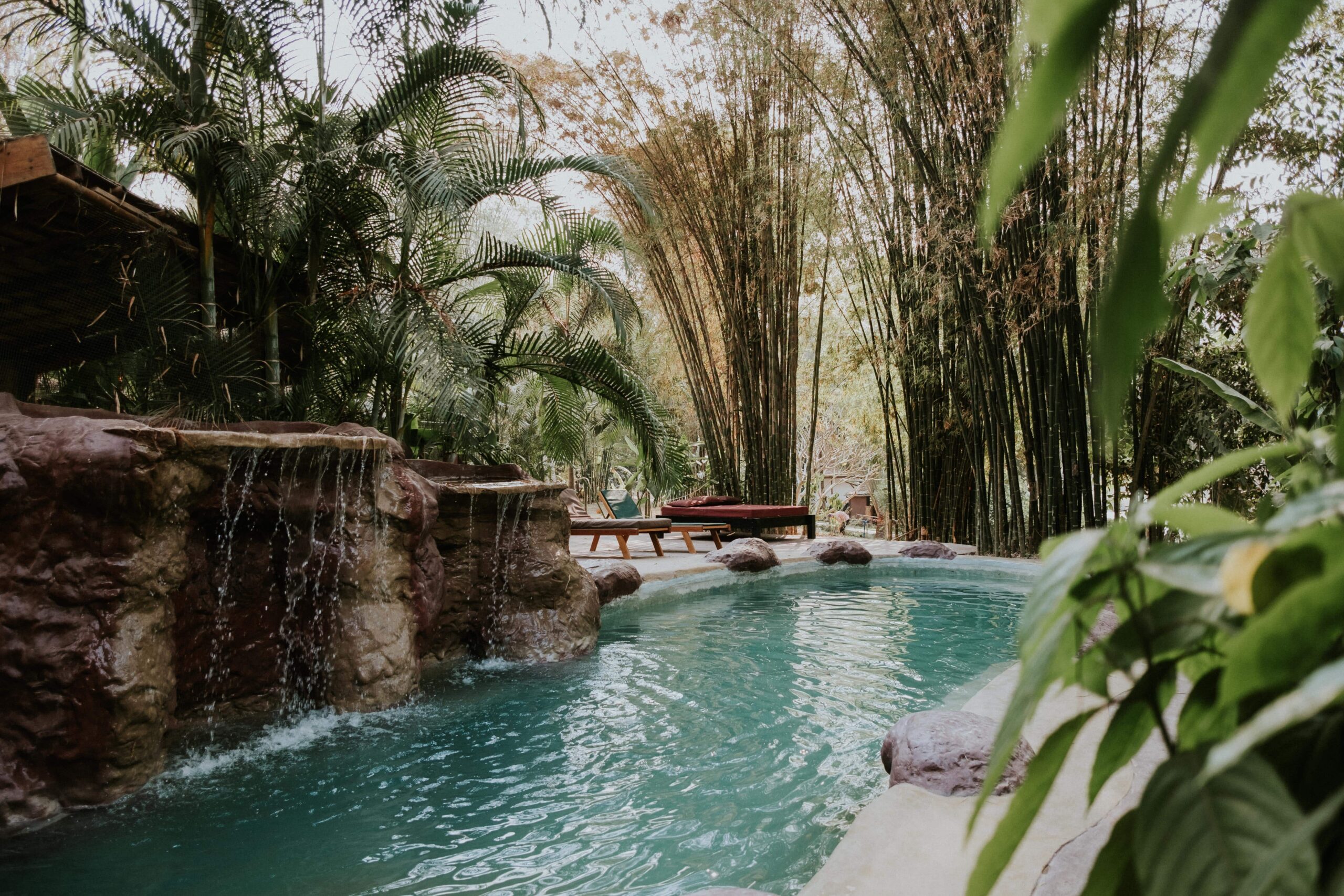 Swimming pool and rock waterfall at The Namkhan Resort & Eco-Farm